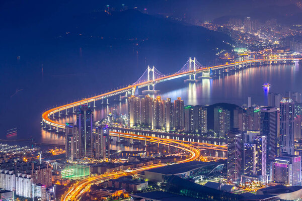 Busan city and skyscrapers in Haeundae district and Gwangan Bridge, Busan South Korea.