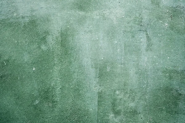 Green concrete stone surface paint wall background, Grunge cement paint texture backdrop, Green rough concrete stone wall background, Copy space for interior design background, banner, wallpaper