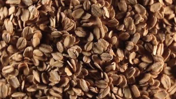 Oat Flakes Background Rotating Left Top View Low Key Light — Stock Video