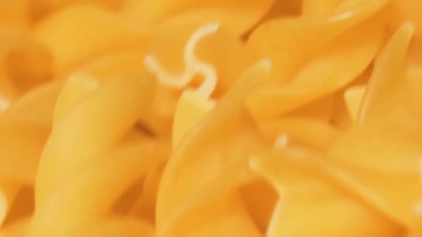 Uncooked Fusilli Pasta Rotating Macro Fat Unhealthy Food Dry Spiral — Stock Video