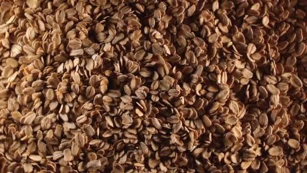 Oat Flakes Background Slowly Rotating Right Top View Low Key — Stock Video