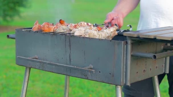 Man Cooking Pork Barbecue Summer Daytime Outdoors Static Shot Slow — Video