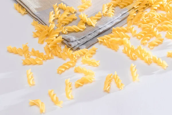 Uncooked Fusilli Pasta Scattered White Table Raw Dry Macaroni Fat — Stock Photo, Image