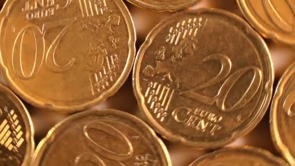 20ユーロセント硬貨 回転マネー背景 トップビュー マクロ ユーロ通貨 20セントの現金がたくさんある 黄金のユーロ円 ビジネス お金の節約の概念 回転右 — ストック動画