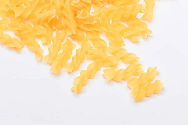 Heap Uncooked Fusilli Pasta Scattered White Table Raw Dry Macaroni — Stock Photo, Image