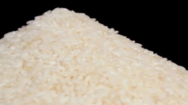 Dry Uncooked White Rice Heap White Plate Rotating Black Background — Stok video