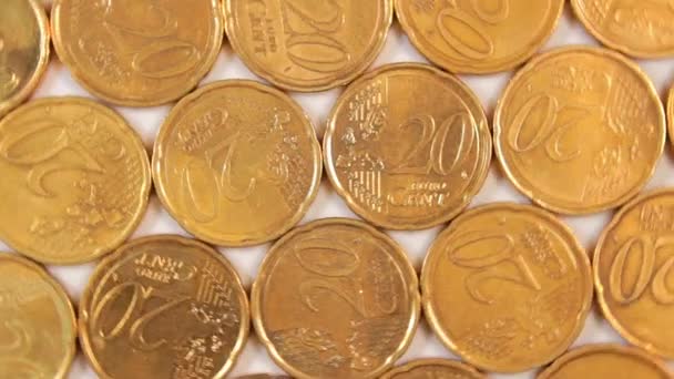 20ユーロセント硬貨 回転マネー背景 トップビュー ユーロ通貨 20セントの現金がたくさんある 黄金のユーロ円 ビジネス お金の節約の概念 遅い回転右 — ストック動画