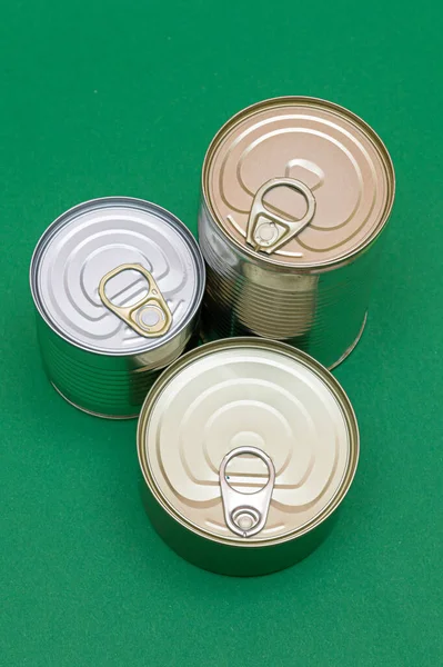Group Stacked Tin Cans Blank Edges Green Background Canned Food — Stock Photo, Image