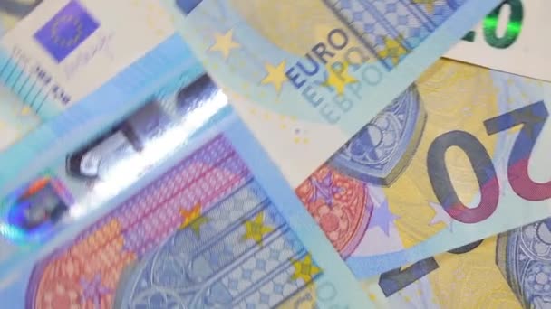 20ユーロ紙幣 回転マネーの背景 トップビュー ユーロ通貨 ブルーペーパーマネー 20ユーロ紙幣がたくさんあります ビジネス 現金および貯金の概念 Angular Rotation — ストック動画