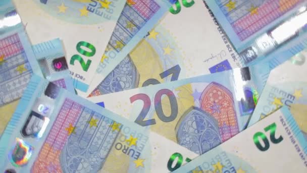 20ユーロ紙幣 回転マネーの背景 トップビュー ユーロ通貨 ブルーペーパーマネー 20ユーロ紙幣がたくさんあります ビジネス キャッシュ お金の節約の概念 遅い回転右 — ストック動画