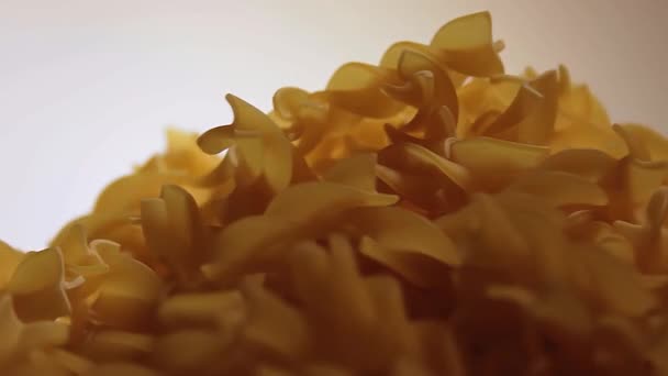 Uncooked Fusilli Pasta Heap Rotating White Background Fat Unhealthy Food — Vídeo de stock