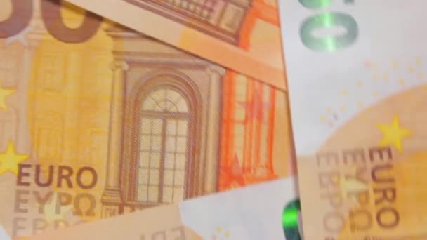 50ユーロ紙幣 回転マネーの背景 トップビュー ユーロマネー通貨 オレンジペーパーマネー 50ユーロビルがたくさんある ビジネス ファイナンス キャッシュ マネーセービングコンセプト — ストック動画