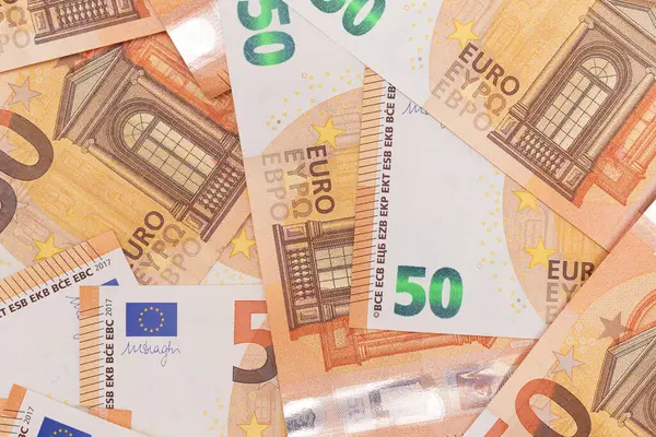 50 Euro Banknotlar Para Arkaplanı. Euro Para Birimi. Turuncu Kağıt Para. Bir sürü 50 Euro 'luk banknot. İş, Mali, Nakit ve Para Tasarruf Konsepti