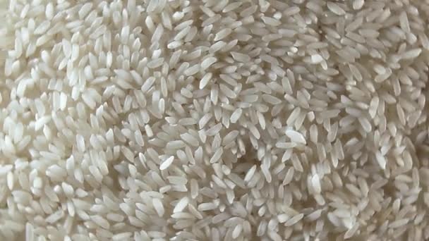 Dry Uncooked White Rice Background Rotating Right Top View Low — Vídeo de stock