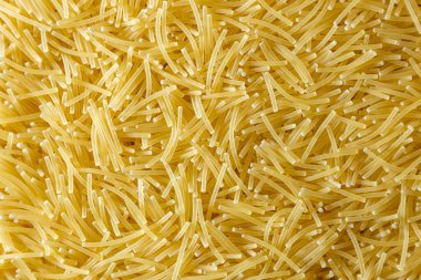 Pişmemiş Filini Makarnası: Gurme Aşçılığı İçin Canlı ve Dokulu Bir Arkaplan Oluşturan Bir Mutfak Makarnası. Kuru makarna. Raw Macaroni - Top View, Düz Yat