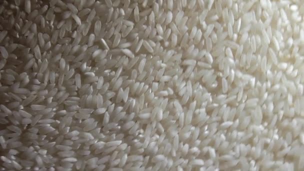 Ξηρό Άψητο Λευκό Ρύζι Φόντο Περιστρεφόμενο Αργά Δεξιά Πάνω Όψη — Αρχείο Βίντεο