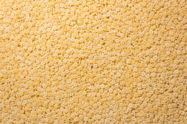 Pişmemiş Stelline Makarna: Gurme Aşçılığı İçin Canlı ve Dokulu Bir Arkaplan Oluşturan Stelline Makarna Mutfağı. Kuru makarna. Raw Macaroni - Top View, Düz Yat