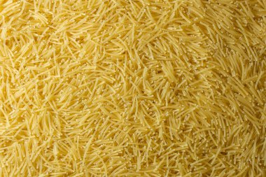 Pişmemiş Filini Makarnası: Gurme Aşçılığı İçin Canlı ve Dokulu Bir Arkaplan Oluşturan Bir Mutfak Makarnası. Kuru makarna. Raw Macaroni - Top View, Düz Yat