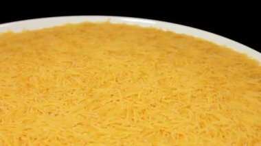 Raw Uncooked Noodles on White Plate Rotating against Black Background. Dry Vermicelli Turning Around. Raw Pasta