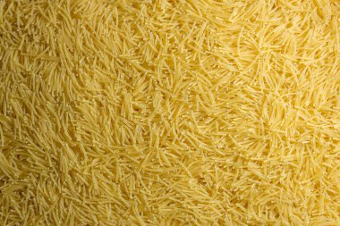 Pişmemiş Filini Makarnası: Gurme Aşçılığı İçin Canlı ve Dokulu Bir Arkaplan Oluşturan Bir Mutfak Makarnası. Kuru makarna. Raw Macaroni - Top View, Düz Yat