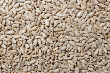 Soyulmuş Ayçiçeği Tohumları Arkaplanı: Kabuksuz Ayçiçeği Tohumları Mutfak Tablosu, Gurme Yemekleri İçin Canlı ve Dokulu Bir Arkaplan Oluşturma - Üst Görünüm, Düz Yatay