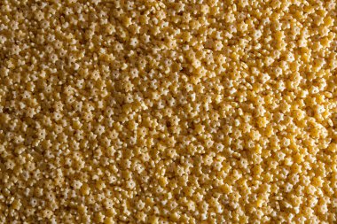 Pişmemiş Stelline Makarna: Gurme Aşçılığı İçin Canlı ve Dokulu Bir Arkaplan Oluşturan Stelline Makarna Mutfağı. Kuru makarna. Raw Macaroni - Top View, Düz Yat