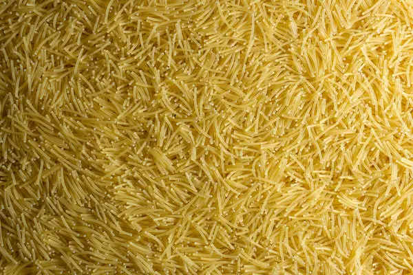 Pişmemiş Filini Makarnası: Gurme Aşçılığı İçin Canlı ve Dokulu Bir Arkaplan Oluşturan Bir Mutfak Makarnası. Kuru makarna. Raw Macaroni - Top View, Düz Yat