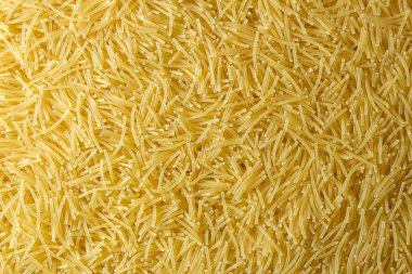 Pişmemiş Filini Makarnası: Gurme Aşçılığı İçin Canlı ve Dokulu Bir Arkaplan Oluşturan Bir Mutfak Makarnası. Kuru makarna. Raw Macaroni - Top View, Düz Yat