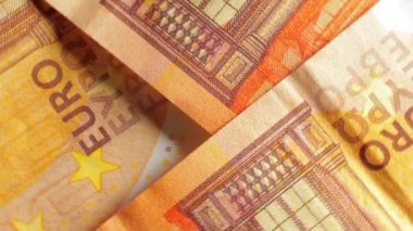 50 Euro 'luk banknotlar, döner para arkaplanı - Top View, Macro. Euro Para Birimi. Turuncu Kağıt Para. Bir sürü 50 Euro 'luk banknot. Ekonomi, Nakit ve Para Tasarruf Konsepti - Yavaş Dönüşüm Sağı