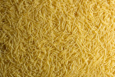 Pişmemiş Filini Makarnası: Gurme Aşçılığı İçin Canlı ve Dokulu Bir Arkaplan Oluşturan Bir Mutfak Makarnası. Kuru makarna. Raw Macaroni - Top View, Düz Yat