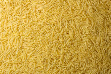 Pişmemiş Filini Makarnası: Gurme Aşçılığı İçin Canlı ve Dokulu Bir Arkaplan Oluşturan Bir Mutfak Makarnası. Kuru makarna. Raw Macaroni - Top View, Düz Yat