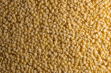 Pişmemiş Stelline Makarna: Gurme Aşçılığı İçin Canlı ve Dokulu Bir Arkaplan Oluşturan Stelline Makarna Mutfağı. Kuru makarna. Raw Macaroni - Top View, Düz Yat