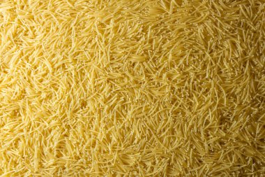 Pişmemiş Filini Makarnası: Gurme Aşçılığı İçin Canlı ve Dokulu Bir Arkaplan Oluşturan Bir Mutfak Makarnası. Kuru makarna. Raw Macaroni - Top View, Düz Yat