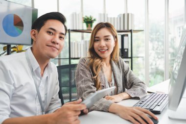 Successful team of new business startup people working together in creative office, happy euphoric proud Asian male and female professional winner feel overjoyed