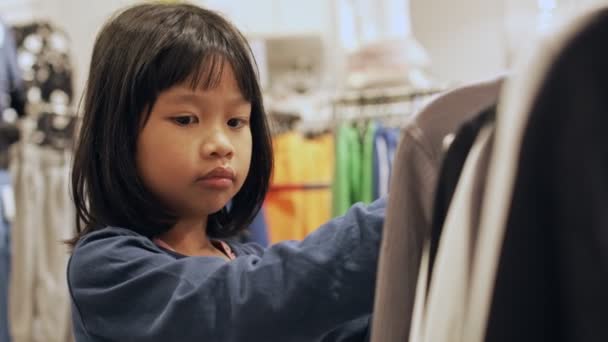 Adorable Little Girl Choosing New Dress Lot Clothes Child Fashion — Stock Video