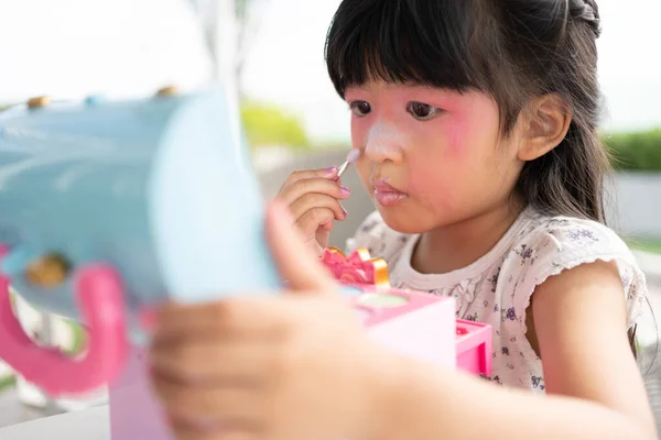 Adorable Little Child Asian Girl Paints Her Mouth Pink Children — Stock Photo, Image