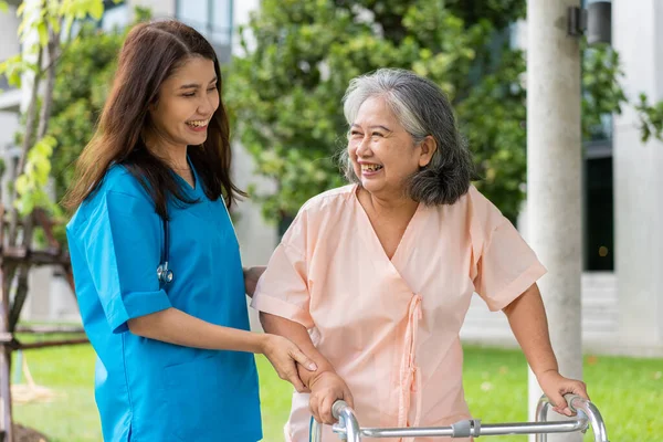 Asian Careful Caregiver Nurse Hold Patient Hand Encourage Patient Walking — Zdjęcie stockowe