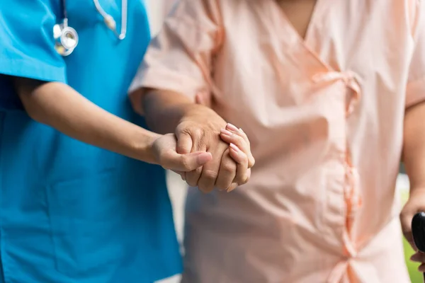 Asian Careful Caregiver Nurse Hold Patient Hand Encourage Patient Walking Imagens De Bancos De Imagens