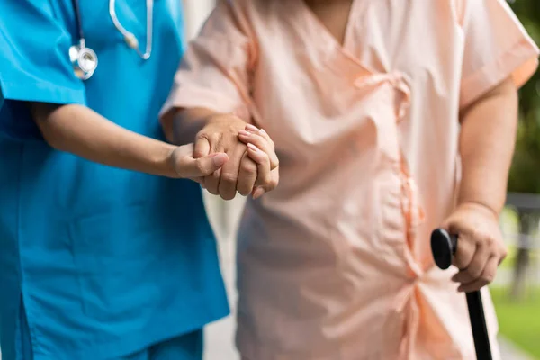 Asian Careful Caregiver Nurse Hold Patient Hand Encourage Patient Walking — Zdjęcie stockowe