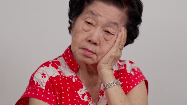 Depressed Asian Senior Woman Lonely Disappointed Lose Memory Isolated White — Stock Video