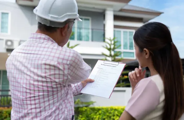 Senior home inspector explains Inspection results with homeowner, handyman holding clipboard and after checking details before renovations home, house improvement interior, Interior design Real estate