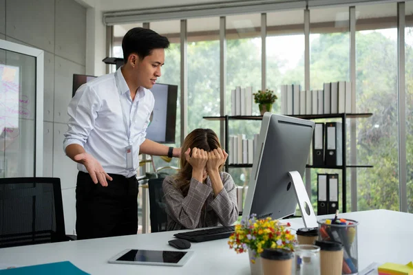 Stressed of female employee and offensive faces that the boss yells, Workplace Conflict, Corporate Communication Problem, stress of business partner discussing, Quarrels, And Bad Attitude At Work