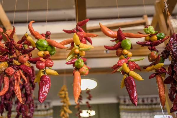 stock image mixed colors chili peppers on sale at covered market, shot in bright fall light at Funchal, Madeira, Portugal