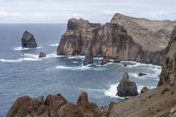 stock image landscape with steep cliffs at island northern shore on Atlantic ocean, shot in bright fall light at Ponta do Rosto, Madeira, Portugal