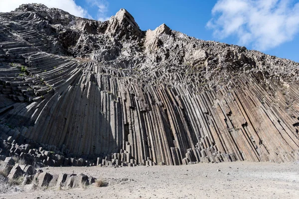 stock image columnar jointed basalt formation, shot in bright fall light at  Pico Ana Ferreira, Porto Santo island, Portugal