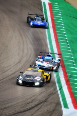 Imola, 21 April 2024: Corvette, BMW and Cadillac in action at WEC FIA World Endurance Championship in Imola, Italy. The series features multiple classes of cars competing in endurance races, with sports prototypes competing in the Hypercar (LMH or LM clipart