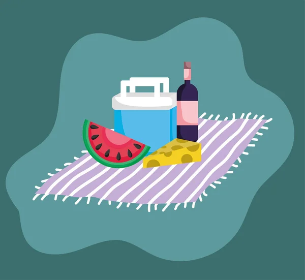 camping food and wine on a blanket