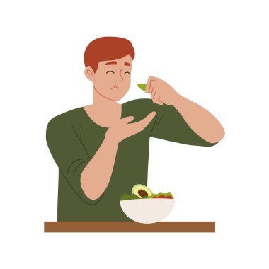 Vejetaryen yemekleri yiyen bir adam.