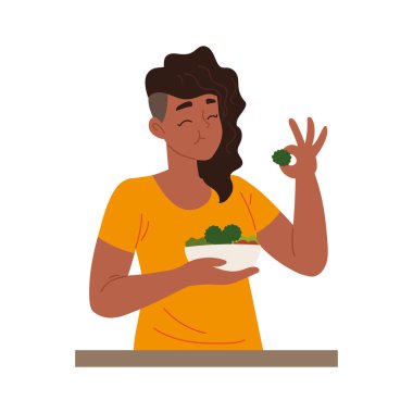 Vejetaryen yemeği yiyen genç bir kadın.