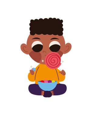 Tatlı çocuk yalnız başına şeker yiyor.